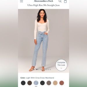 Ultra High Rise 90s straight jean, light with criss cross waistband. Size 6